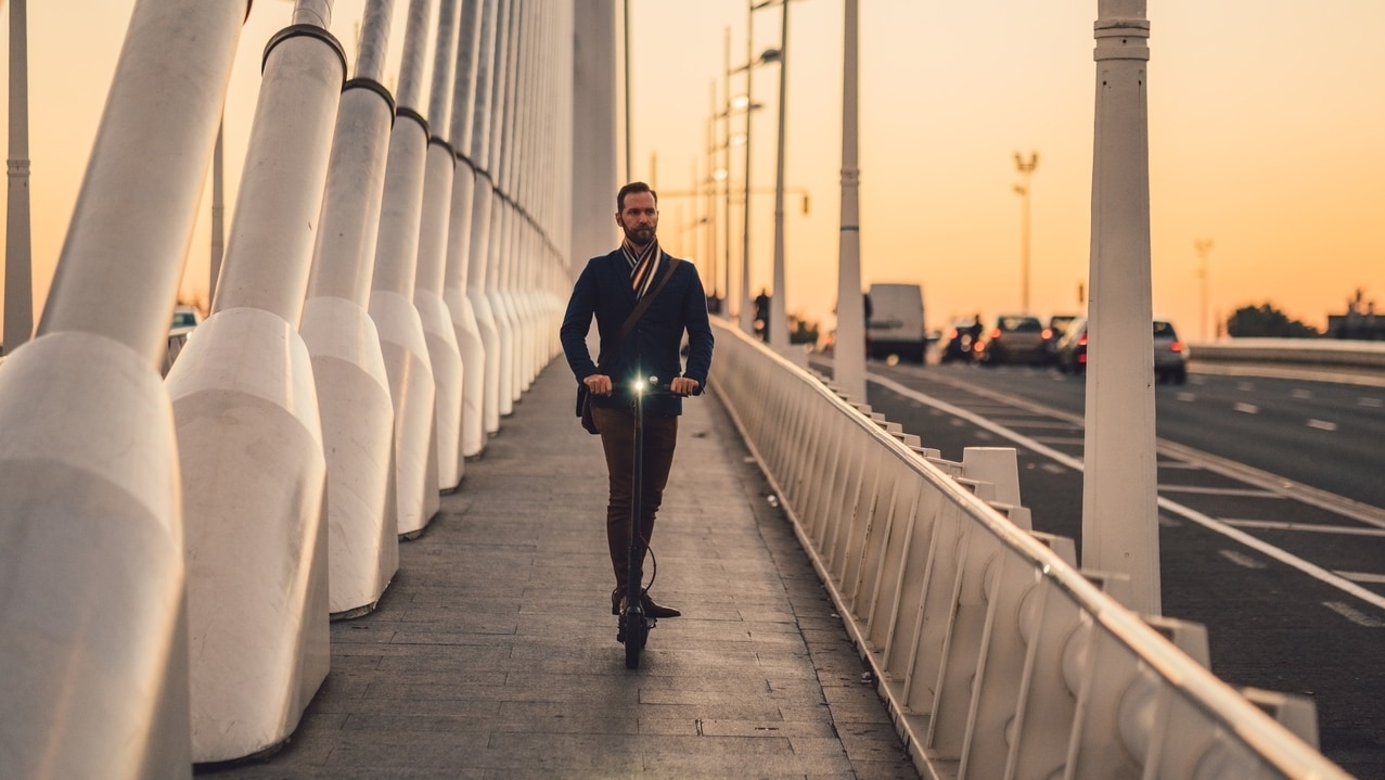male professional on the bridge sidewalk